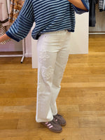 Ruffled flower jeans